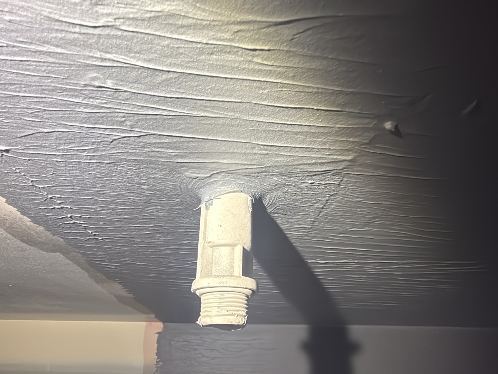 Waterproofing to a shower outlet lug incomplete, recorded on a fixing stage inspection in Pakenham, 4 km from Pakenham East